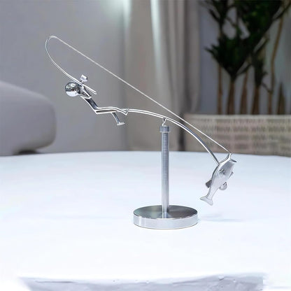 balanced fisherman sculpture