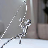 balanced fisherman sculpture