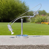 balanced fisherman sculpture